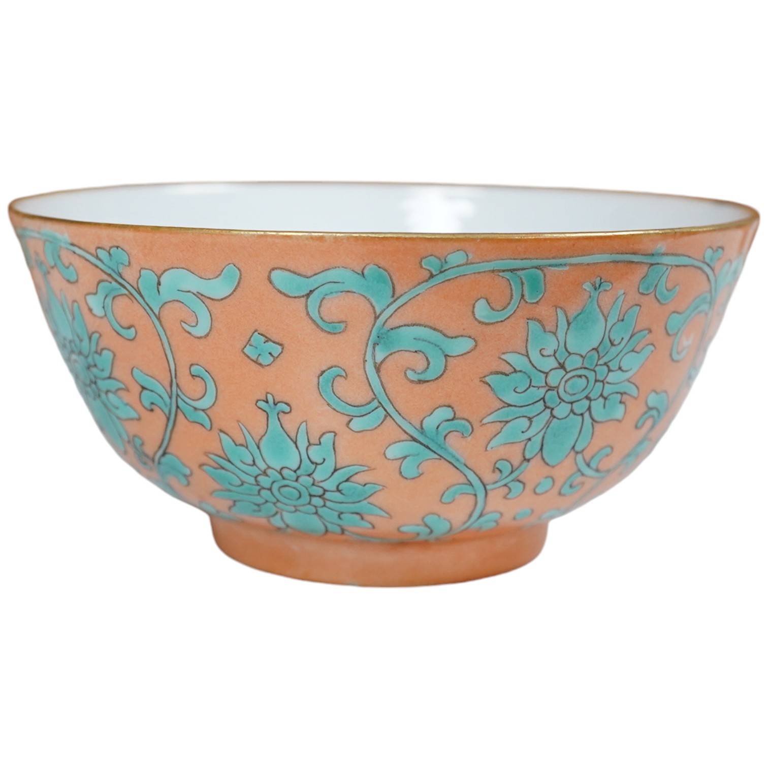 A Chinese pale coral ground ‘lotus’ bowl, Tongzhi mark and period, 12cm diameter. Condition - good